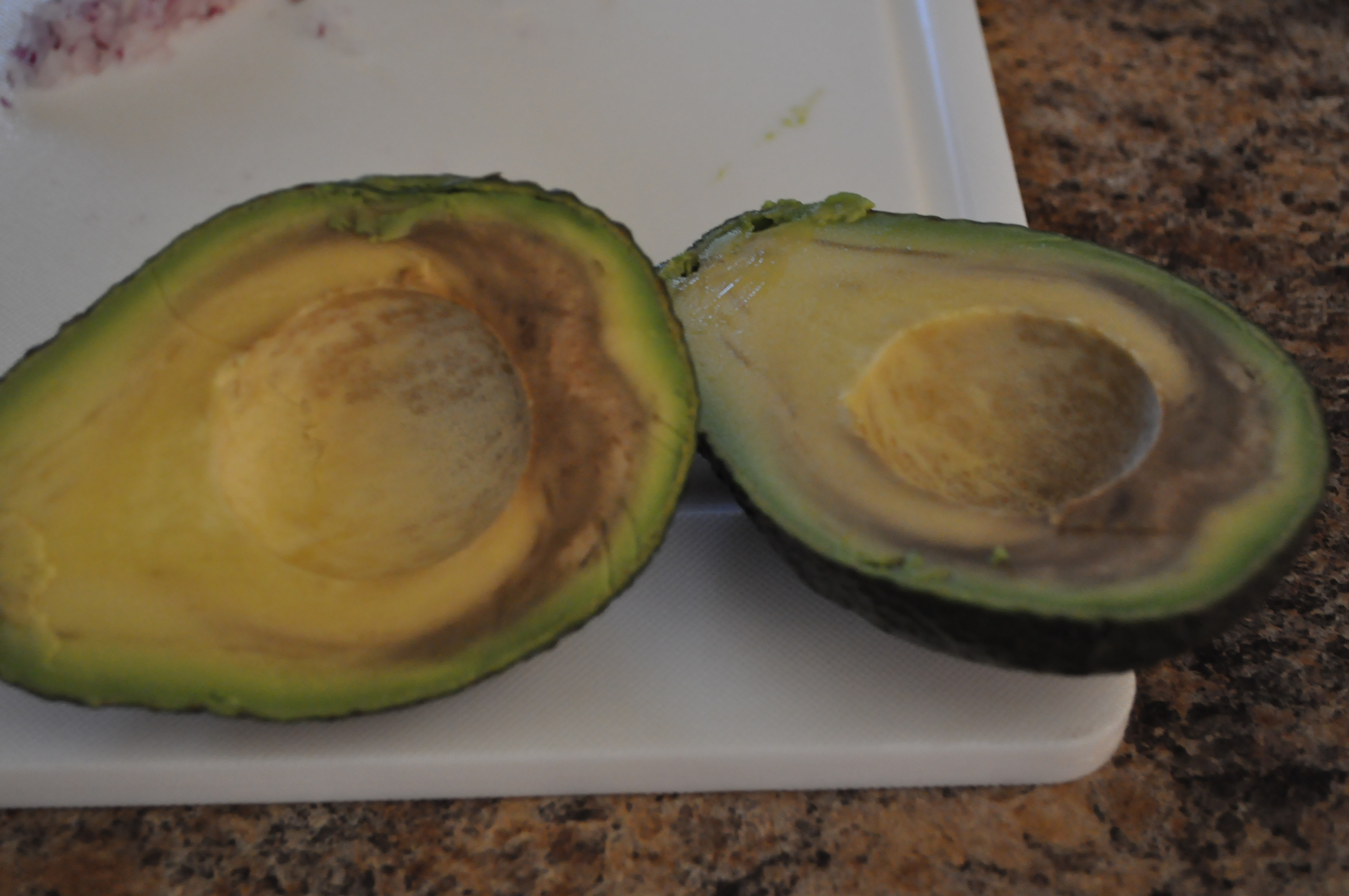 How can a person tell if an avocado is rotten?